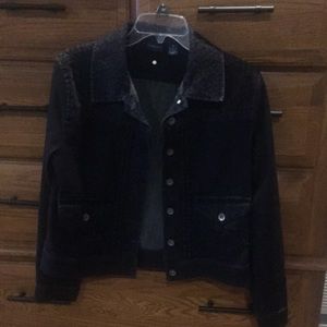 Black denim jacket with animal print on shoulder and collar.